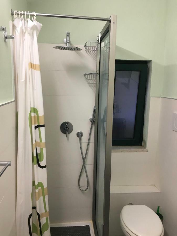 Monolocale I Delfini Apartment Мондело Екстериор снимка
